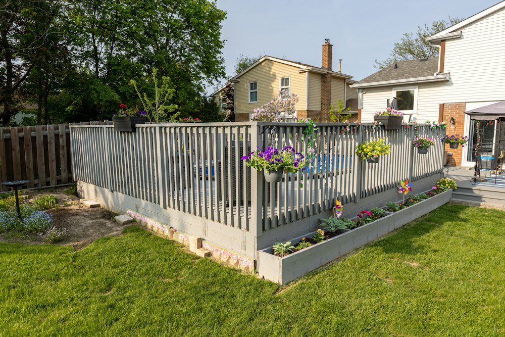 Backyard with a deck and fence